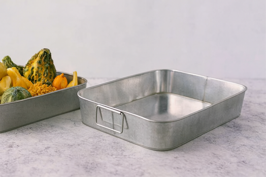 Rectangular metal trays with decorative gourds in rustic kitchen